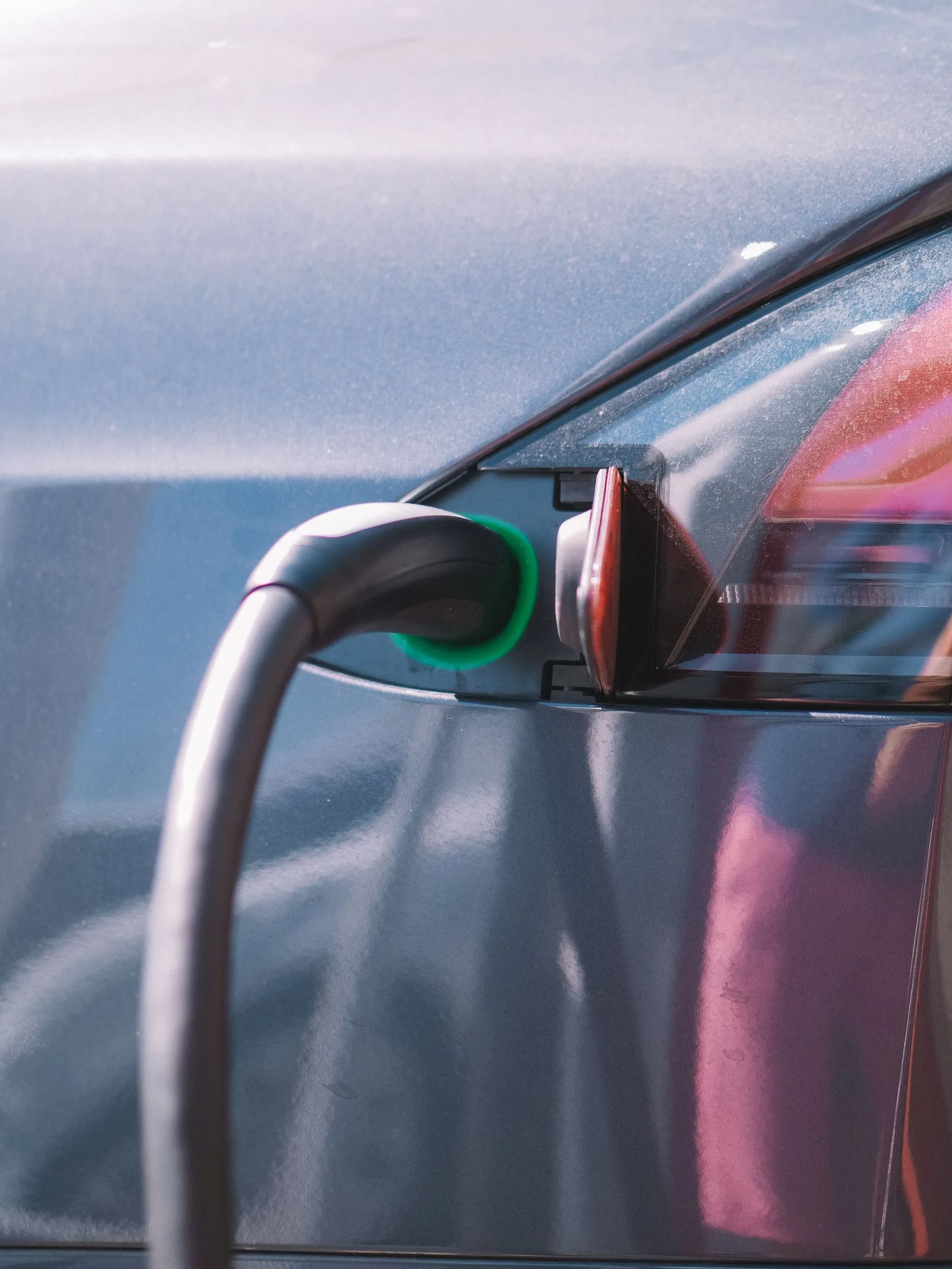 Charging cable connected securely to a vehicle